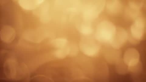 Loopable Warm Golden Bokeh Motion - Cinematic Abstract Background with Flare Rings