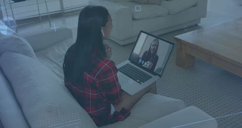 Woman Video Calling on Laptop in Modern Living Room
