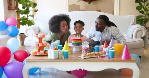 Family Birthday Celebration with Candles and Cake