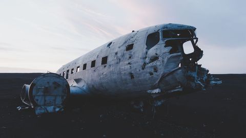 Abandoned wreckage of warfare plane crash on desolate beach