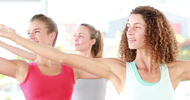 Group of Women Practicing Yoga Poses in Bright Studio - Download Free Stock Images Pikwizard.com