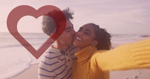 Romantic Couple Capturing Moments on Beach with Heart Overlay