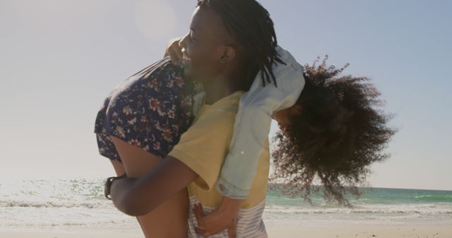 Playful Father and Daughter Spending Time Together on Sunny Beach - Download Free Stock Images Pikwizard.com