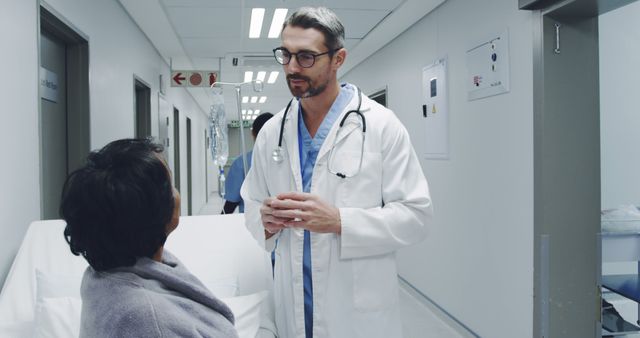 Doctor Speaking with Patient in Modern Hospital Corridor - Download Free Stock Images Pikwizard.com