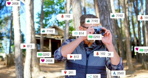 Photographer Capturing Nature Surrounded by Social Media Notifications