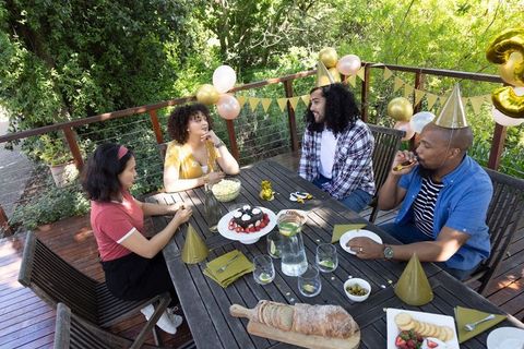 Diverse Group of Friends Celebrating Birthday Outdoors