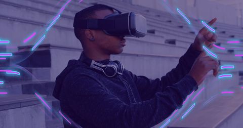 Man Exploring Virtual Reality with VR Headset and Glowing Data Trails - Download Free Stock Images Pikwizard.com