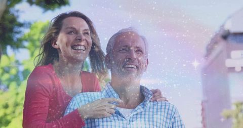 Happy Couple Embracing Outdoors with Magical Sky