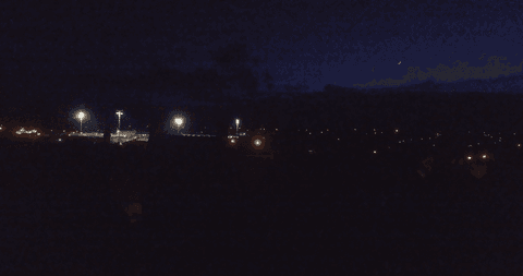 city illuminated by street lights with starry night sky - Download Free Stock Videos Pikwizard.com