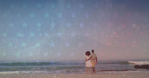 Romantic Couple Walking on Starry Beach at Sunset
