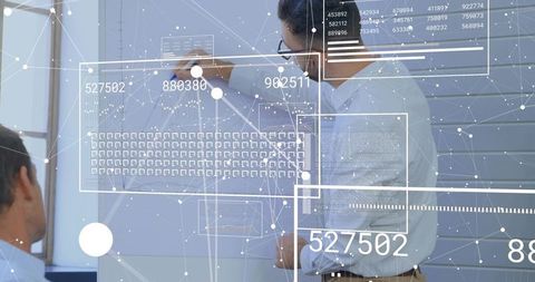 Business professional presenting data visualization on whiteboard with AR overlays
