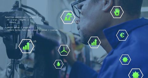Technician Analyzing Industrial Processes with Data Visualizations