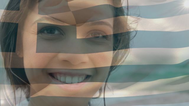 Smiling woman with Greece flag waving over her face, showing national pride and positive spirit. Ideal for use in campaigns promoting national identity, advertisements for travel to Greece, or health measures during COVID-19 pandemic. Creative visual representing unity and community strength.