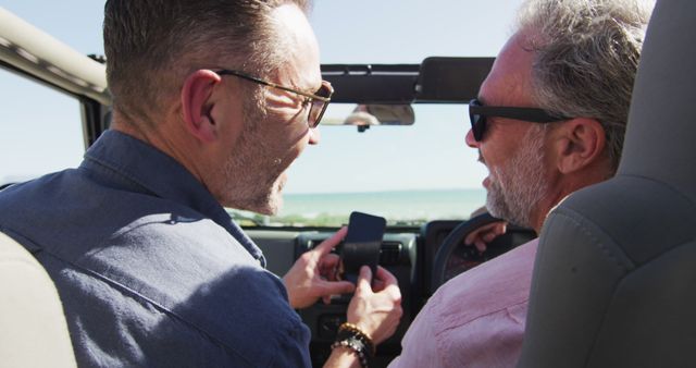 Two Older Men Enjoying Road Trip in Convertible by Seaside - Download Free Stock Images Pikwizard.com