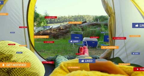 Relaxed Camper Enjoying Peaceful Morning by Lakeside Tent