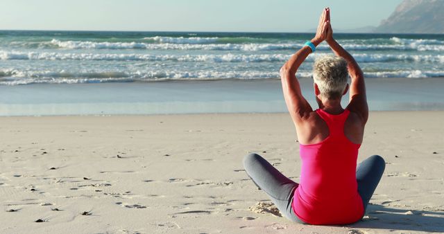 Senior Woman Meditating on Beach in Lotus Position - Download Free Stock Images Pikwizard.com