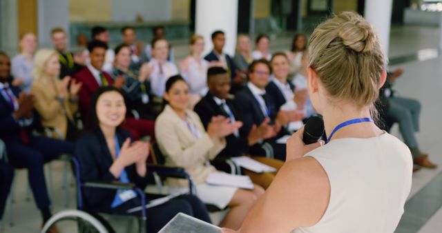 Businesswoman Speaking in Conference Room to Applauding Audience - Download Free Stock Images Pikwizard.com