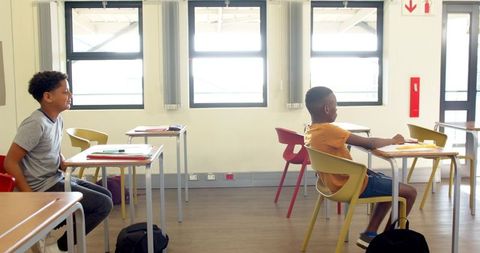 Diverse Students Engaged in School Classroom Activities