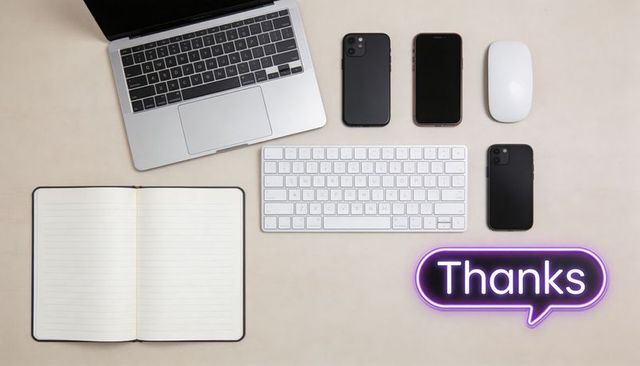 Arranging flat lay workspace showing laptop keyboard phones mouse notebook neon thanks