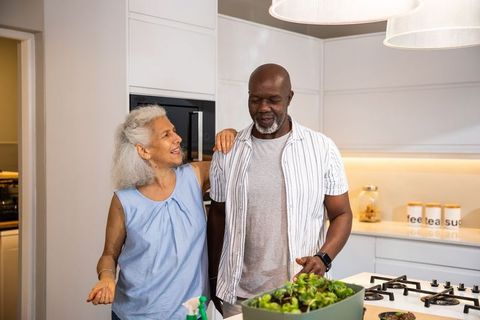 Senior Couple Enjoying Conversation in Modern Kitchen