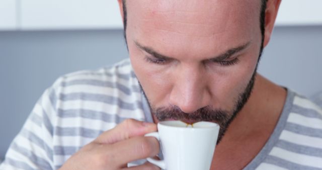 Man Enjoying Hot Beverage from White Cup - Download Free Stock Images Pikwizard.com