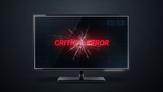 Shattered monitor displaying red critical error alert with glitch lines and crack