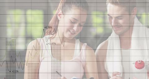 Fit individuals analyzing fitness data on device