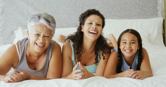 Multi-Generational Family Relaxing Together on Bed - Download Free Stock Images Pikwizard.com