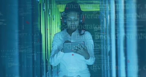 Female it technician using tablet in data center overlayed with code