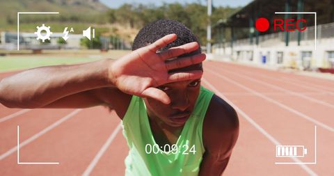 Recording Athlete Wiping Forehead on Race Track - Download Free Stock Images Pikwizard.com