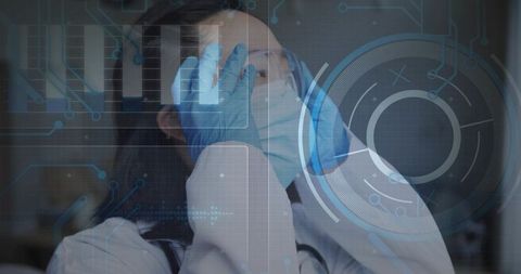 Korean female doctor rubbing eyes wearing ppe showing fatigue and stress with hud overlay