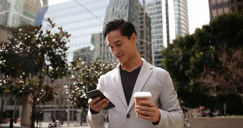 Young Asian Professional Having Coffee During Urban Break - Download Free Stock Images Pikwizard.com