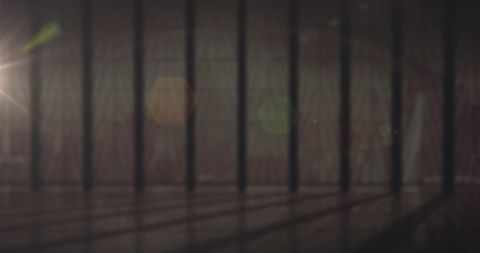 Blurred Light through Bars with Flickering Colorful Spots