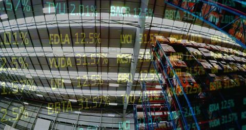Digital overlay of stock market projections in industrial warehouse