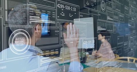 Professionals Engaging with Futuristic Interface in Meeting Room