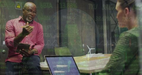 Diverse coworkers collaborating in global stock market analysis