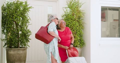 Senior Lesbian Couple with Luggage on Vacation