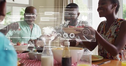 Multigenerational family sharing sunlit meal while engaging with futuristic hud overlay