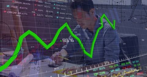 Asian male architect analysing financial and mathematical data