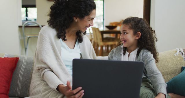 Mother and Daughter Using Laptop at Home, Smiling and Bonding - Download Free Stock Images Pikwizard.com