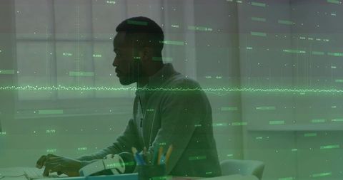 Focused man analyzing data in virtual reality workspace