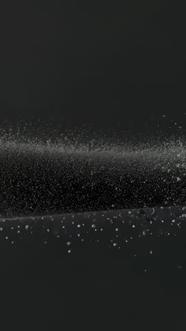 Vertical particle burst to drifting dust and thin dispersion for futuristic motion