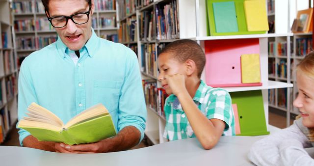 Male Teacher Reading to Children in Library - Download Free Stock Images Pikwizard.com