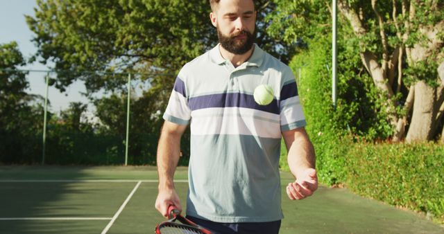 Image of happy caucasian men playing tennis on the court. Healthy active lifestyle and fitness at home.