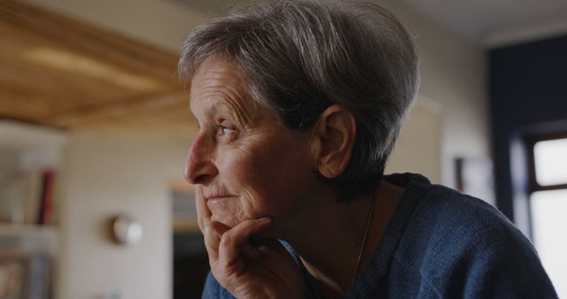 Elderly Woman Reflecting in Thoughtful Pose Indoors - Download Free Stock Images Pikwizard.com