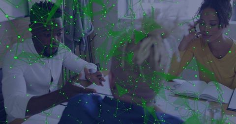 Business team collaborating with green digital network overlay connecting ideas in meeting