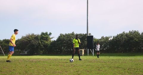 Men's Soccer Players Engaging in Field Play