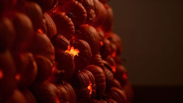Glowing Mini Pumpkins with Star Lights in Darkened Interior