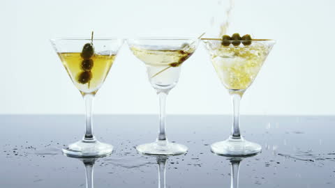 Three Martini Glasses with Cocktail Olives