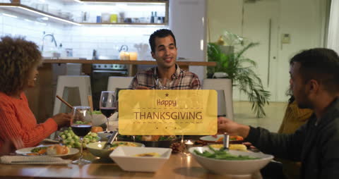 Diverse Group Celebrating Thanksgiving Over Dinner
